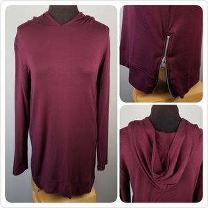 Hooded athleisure top with zipper accents